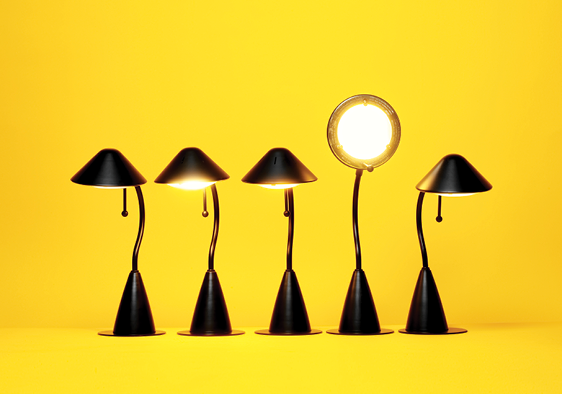 /assets/istock-157425435_five_lamps_one_shining_up_yellow_background_fmt.png